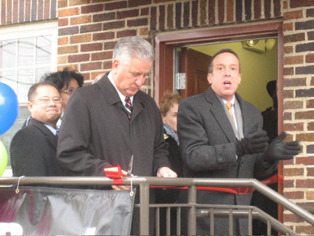 Steve Longo At Right Introduces The Mayor, Who Contemplates His Ribbon