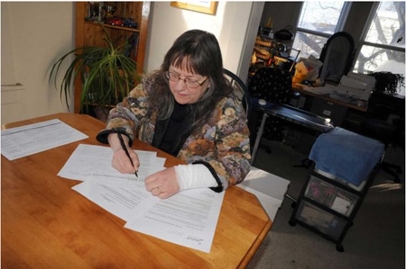 The Wife In Her Home Office Showing Paperwork To The Content Providers