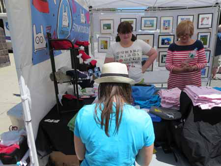 Stinkydog artist Samantha McCullough (Back To Camera) Selling Stinky Art