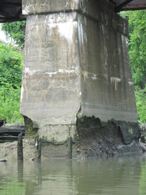 Rotting Pier Under The Rail Bridge, Photo From 2010 Taken At Low Tide