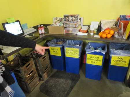 Recycling Cans Behind The Service Desk At Honest Weight Coop