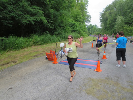 Claire Nolan Arriving In Guilderland, She Did The Entire Triathlon Barefooted
