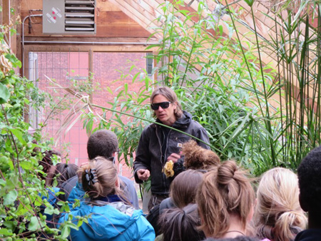 Urban Farmer Scott Kellog Conducts A Tour Of The Radix Center Greenhouse