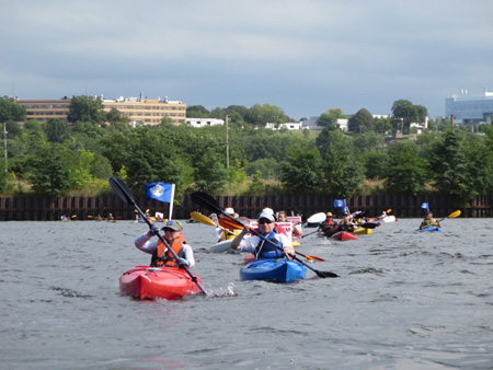 A Brief Line Of Kayaks And Canoes Across The Hudson