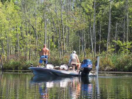 Fishing On Fish Creek, Note The Shiny Oil Slick On The Water