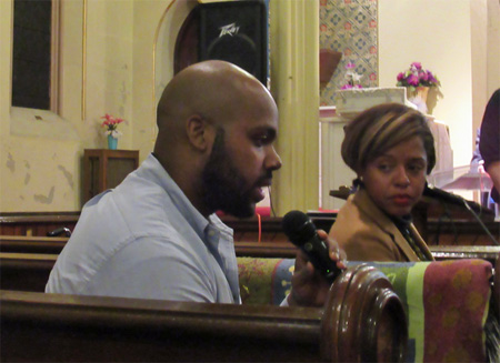 Jahkeen Hoke Speaks While Common Council Member Dorcey Applyrs Listens 