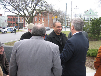 DA Soares Greeted By The Mayor, As Seen Over Dominick Calsolaro's Broad Shoulders