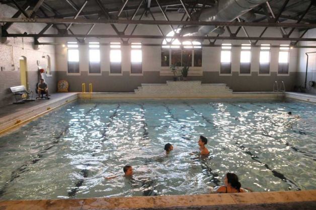 Adults and children take a last swim in the Public Bath No. 2 in Albany on Thursday, Dec. 30, 2010, the last day the bath was open. (Paul Buckowski / Times Union (Paul Buckowski)  Read more: http://www.timesunion.com/local/article/Pool-fans-make-splash-on-last-day-928525.php#ixzz1Ah8yLj00