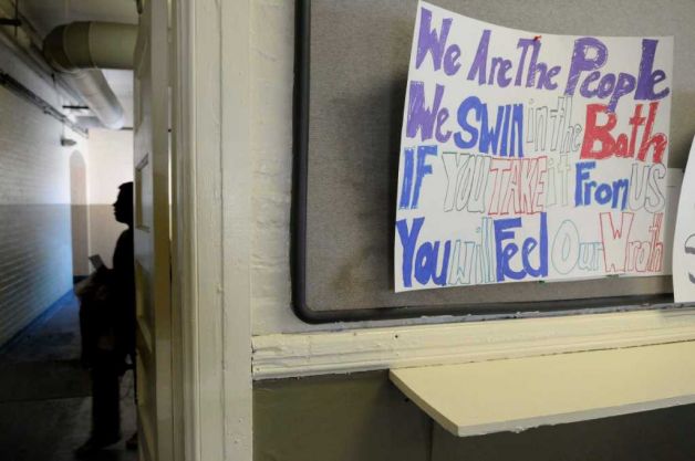 A sign put up by protestors is seen in the lobby as community organizers and residents of Albany's South End held a sit-in at the City's Public Bath No. 2 on Thursday, Dec. 30, 2010. The group wanted to talk with Mayor Jery Jennings before leaving, but in the end settled for a future meeting to discuss ways to re-open the bath house. (Paul Buckowski / Times Union)  Read more: http://www.timesunion.com/local/article/Pool-fans-make-splash-on-last-day-928525.php#ixzz1Ah9LdhxA