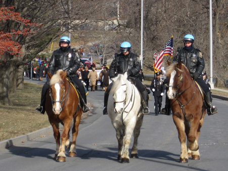 Cold Cops On Horses Leading The March
