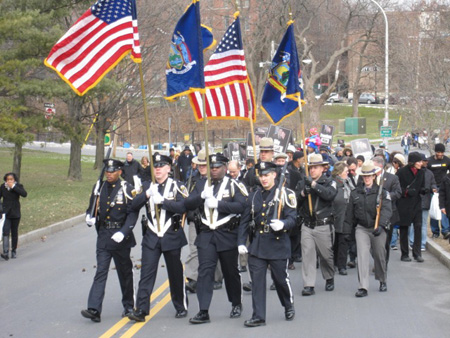 The State Police Color Guard Leads The March
