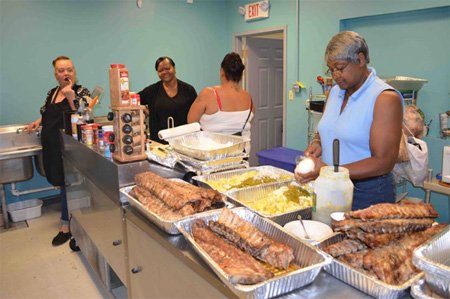Volunteers Prepare Traditional Southern Style Food For Mississippi Day (Photo From AVillage)