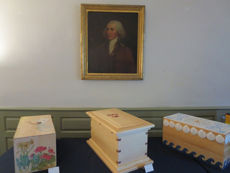New Caskets Containing The Remains Of Three Of Philip Schuyler’s Slaves Beneath A Portrait Of Their Master Inside His Albany House, April 2016