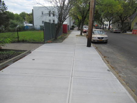Freshly Laid New Sidewalk In Front Of The Site (Which The City Probably Shouldn’t Have Done)