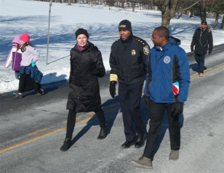State Assembly Member Pat Fahy And Albany Police Chief Eric Hawkins Converse And Grimace, While Albany Recreation Commissioner Jonathan Jones Seems To Enjoy The Weather